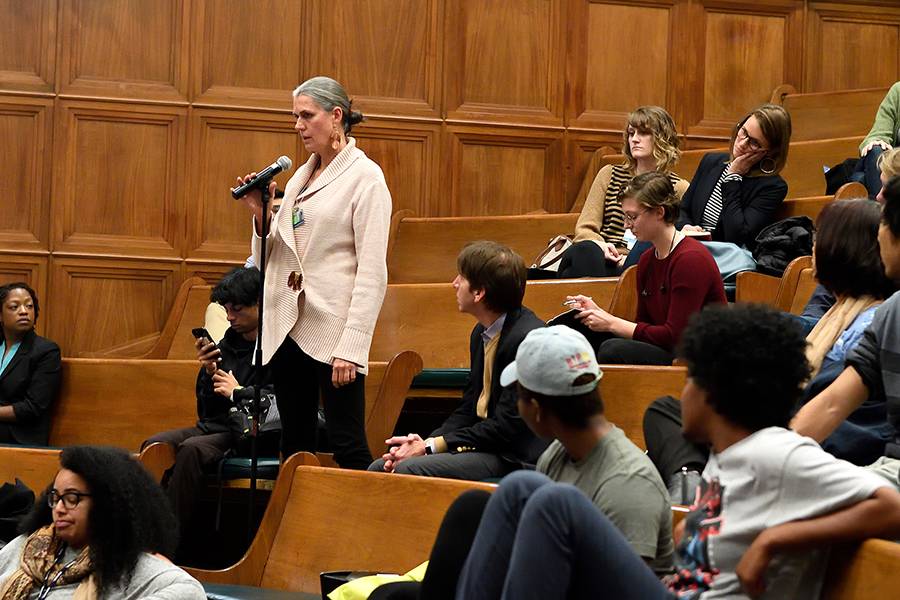 An audience member asks a question during a Q+A