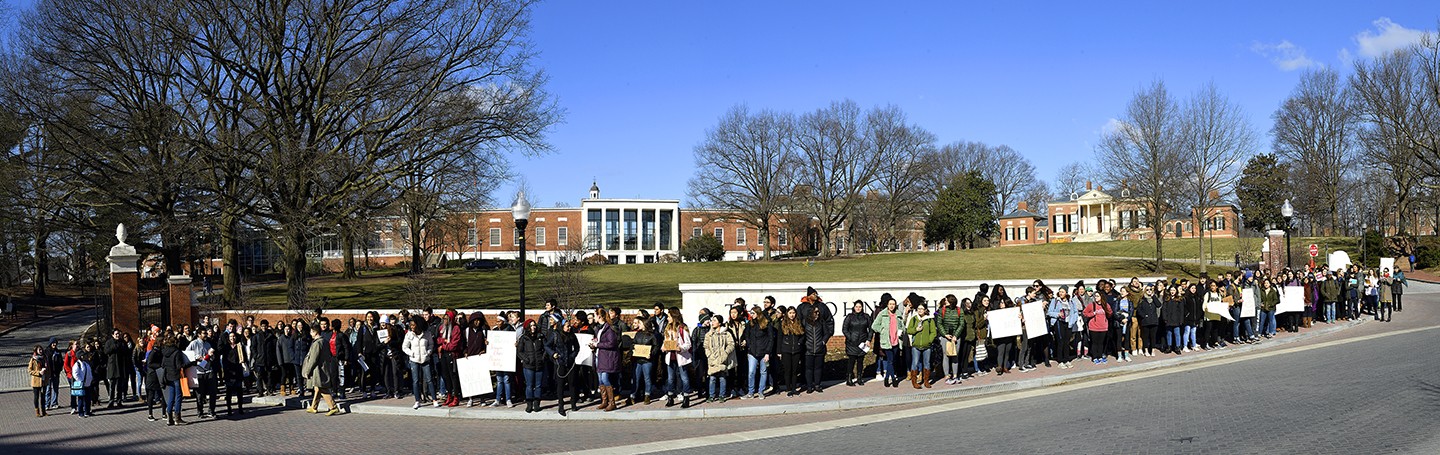 Student protesters line Charles Street in front of the Johns Hopkins University campus