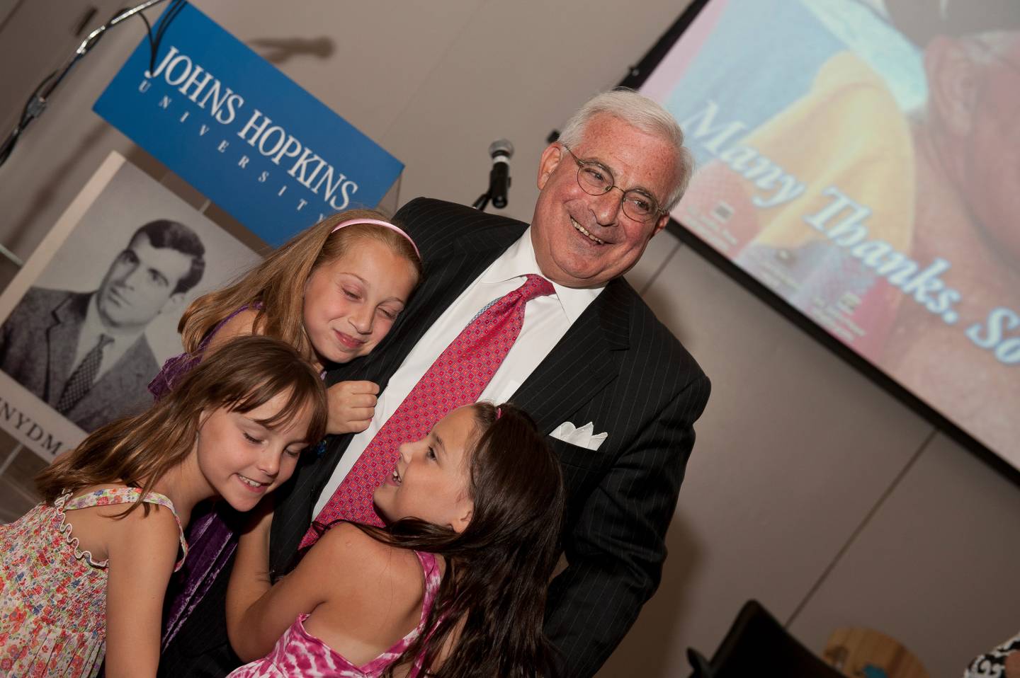 Jerry Schnydman with three granddaughters