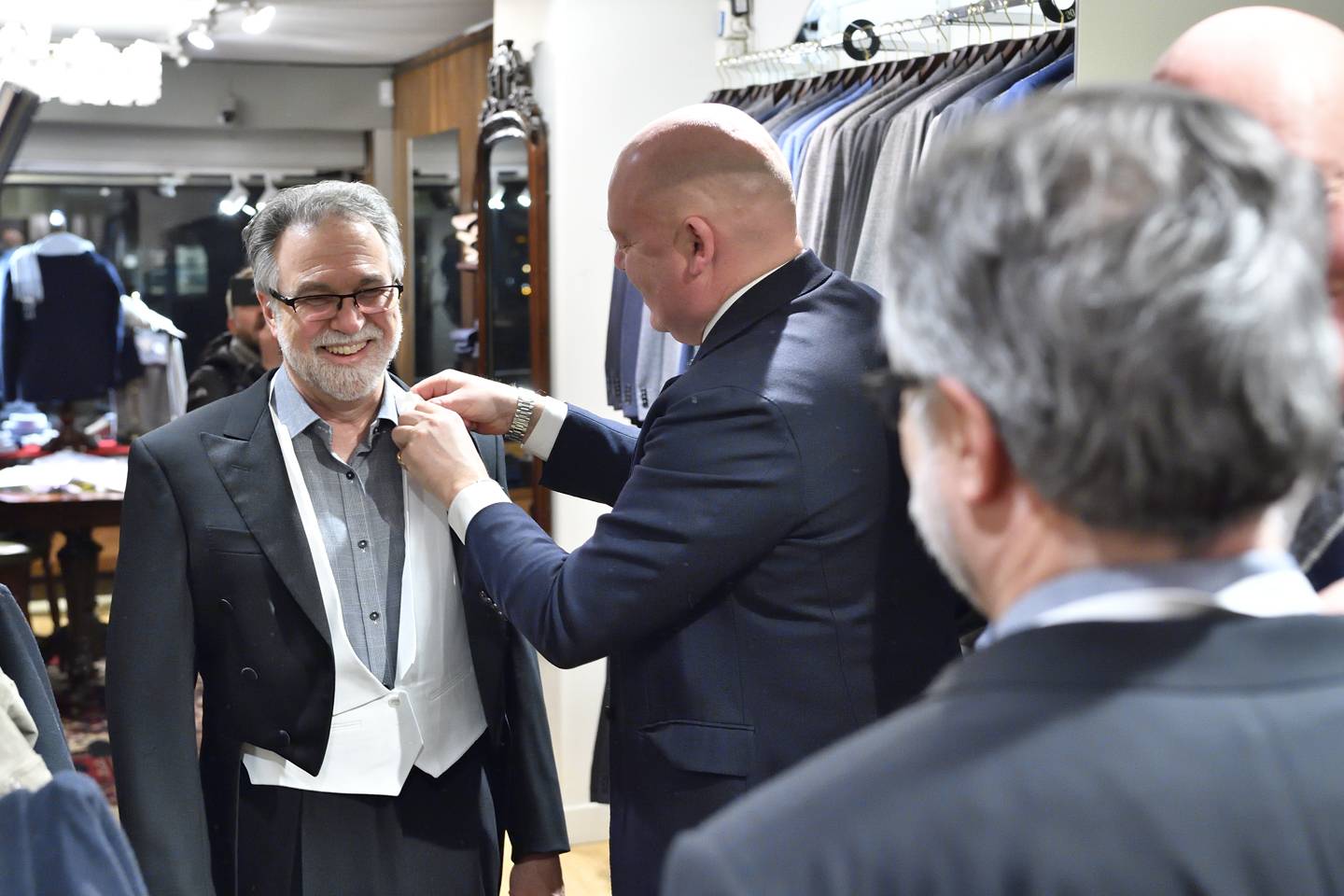 Gregg Semenza is fitted for a white tie tuxedo