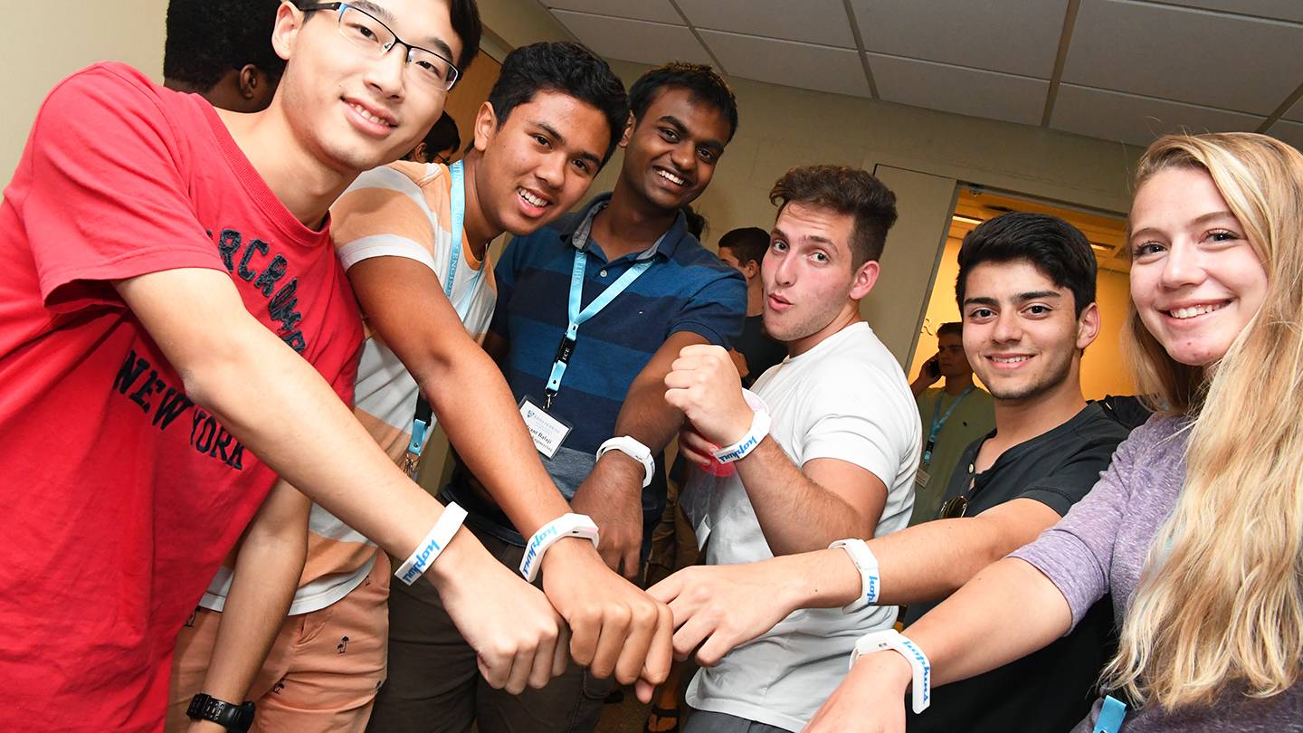 Group of students show off wearable tech device Aura Spark Group of students show off wearable tech device Aura Spark