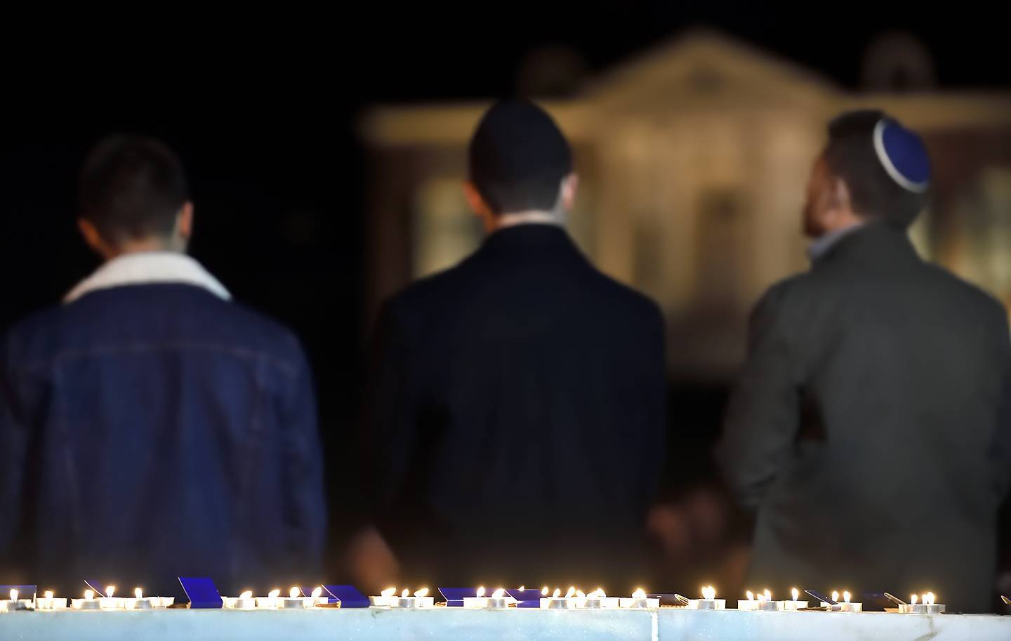 People attend a vigil