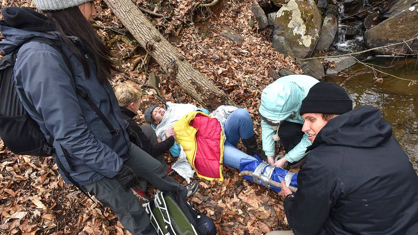 Students tend to a fallen hiker as part of JHU's Austere Medicine/Wilderness Medicine course Students tend to a fallen hiker as part of JHU's Austere Medicine/Wilderness Medicine course