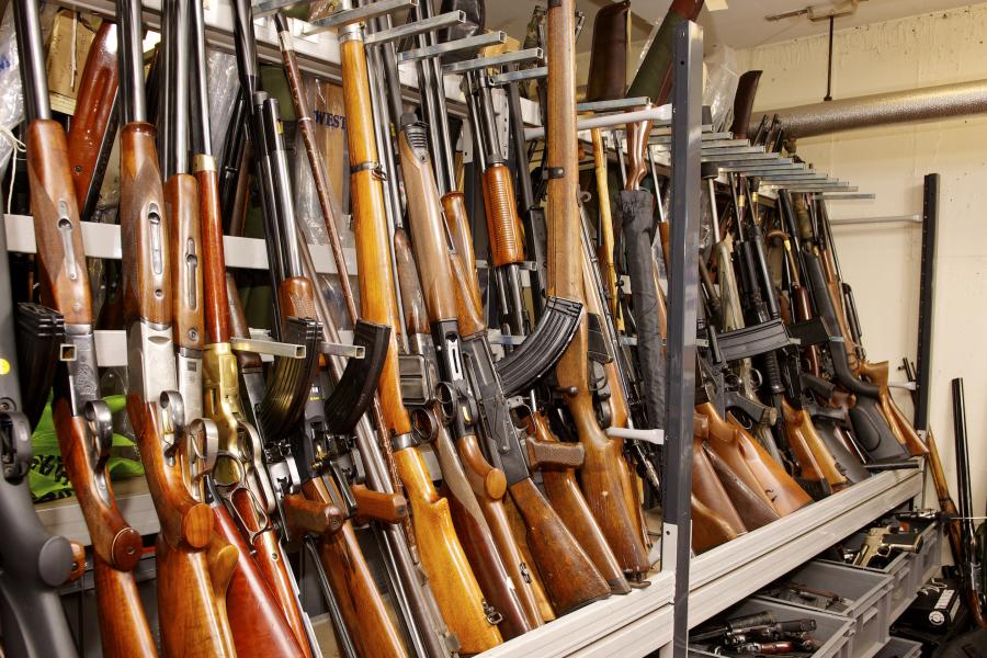 Racks of seized firearms in a police store room 