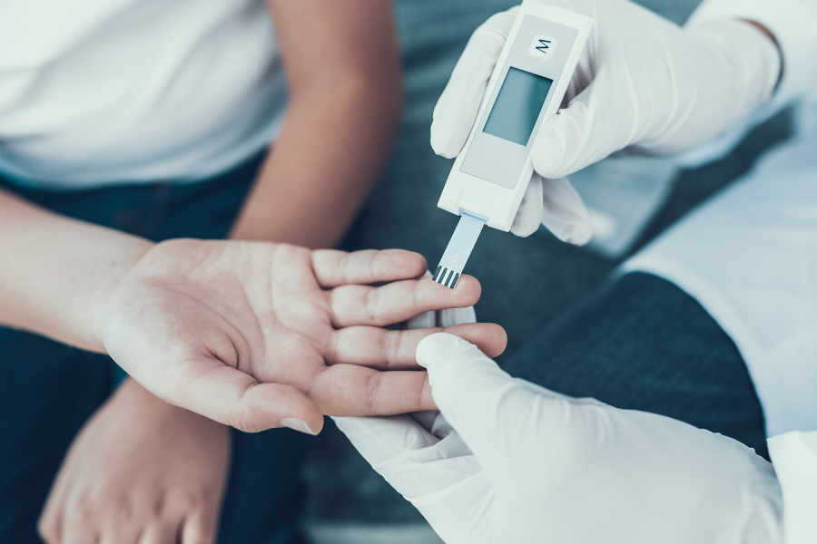 A child's insulin levels are checked by a doctor