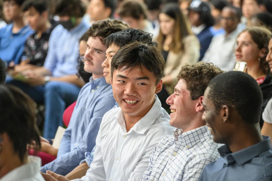 People in a crowd talk to each other