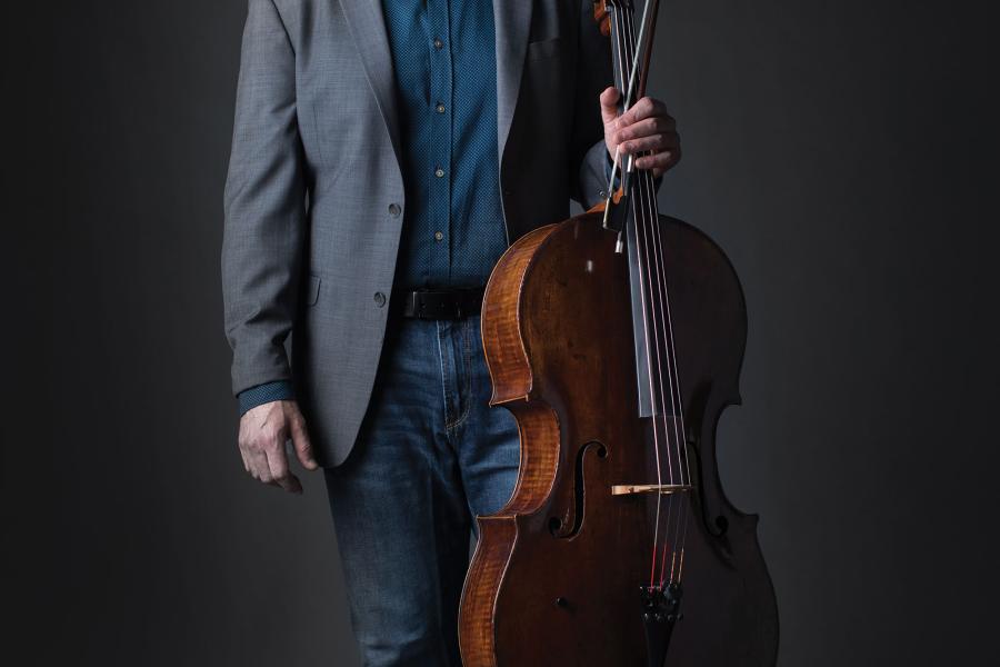 Joel Dallow poses with a cello