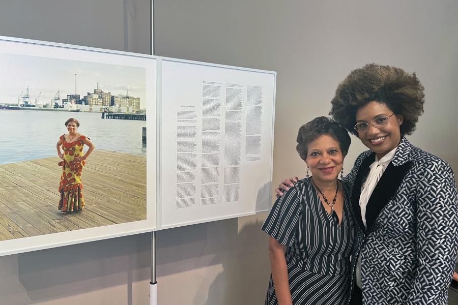 Lisa Cooper (left) and LaToya Ruby Frazier pose together in front of a portrait of Cooper