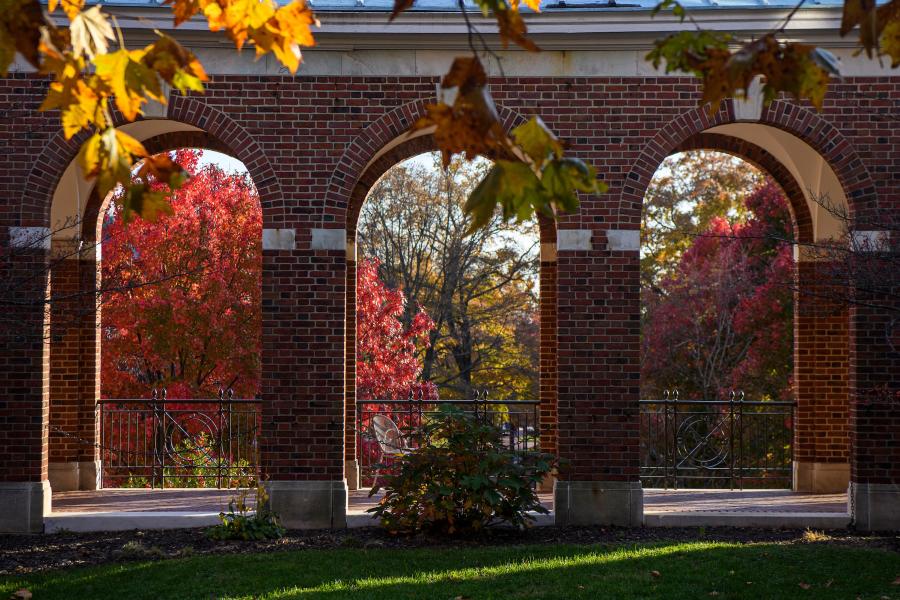 Brick archways surrounded by fall trees