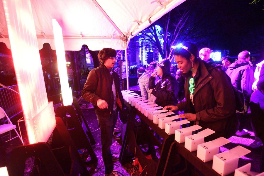 A person plays a large organ