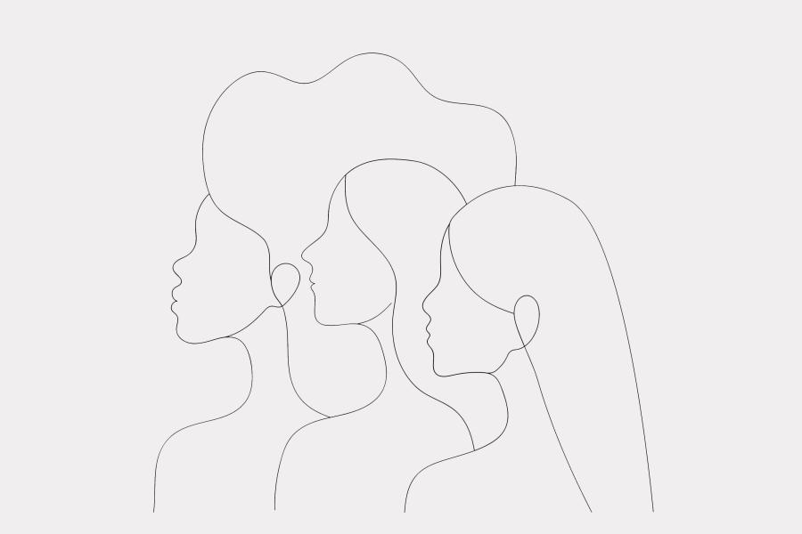 Women of different races standing together. Profile silhouettes of three female characters with varaious hairstyles.