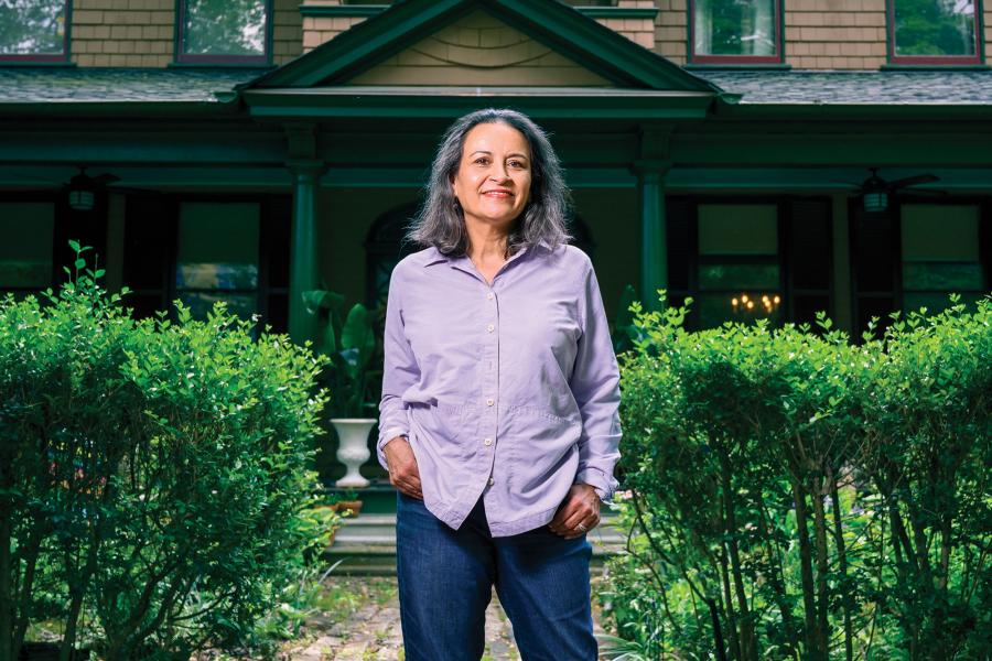 Sujata Massey stands in front of her Baltimore home