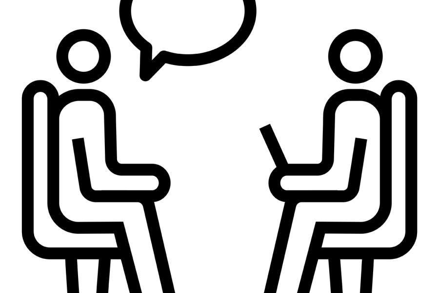 A line drawing of two seated people facing each other with an empty talk bubble over one of the figures