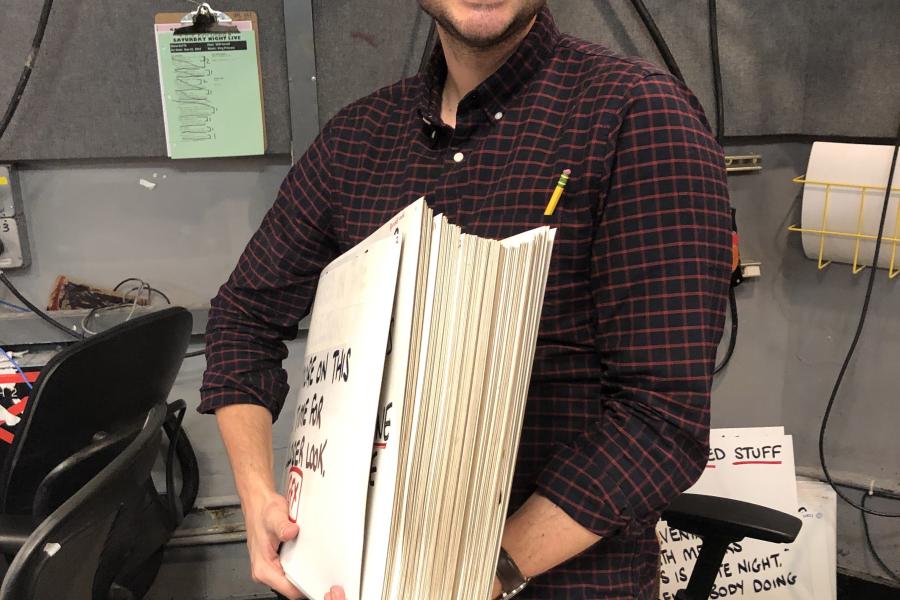 Sal Gentile holds cue cards backstage at Late Night with Seth Meyers