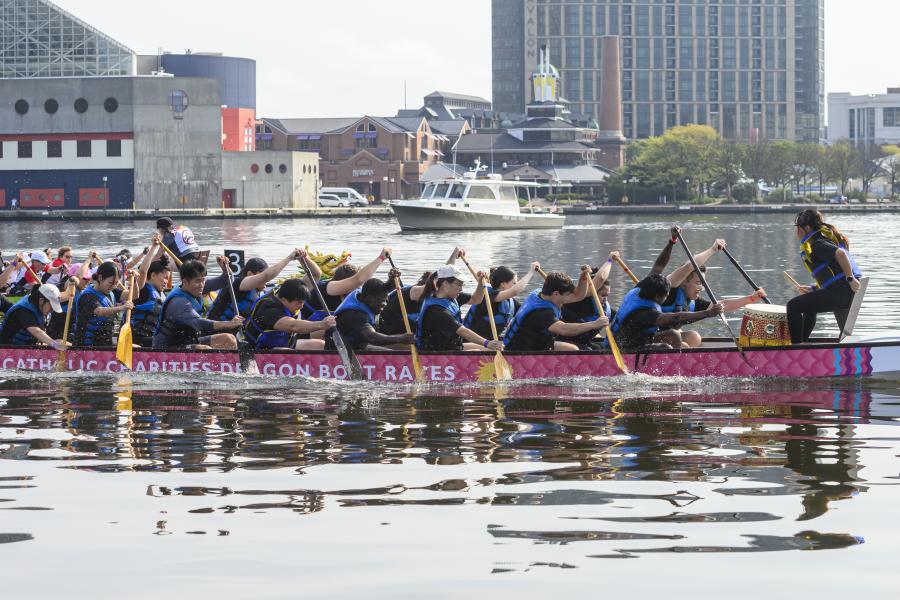 A dragon boat team races across Baltimore's Inner Harbor