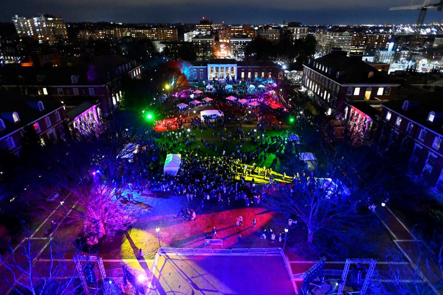 An aerial view of Keyser Quad lit up in rainbow colors