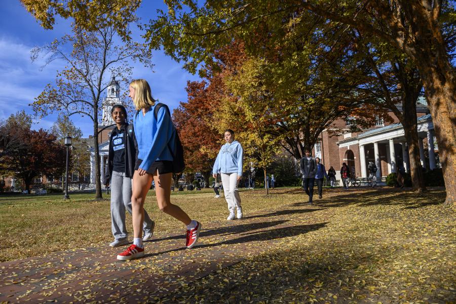 Students walking on the Homewood campus in the fall