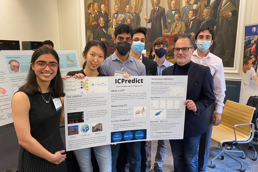 BME students and Dr. Robert Stevens presenting ICPredict at 2022 Johns Hopkins BME Design Day 