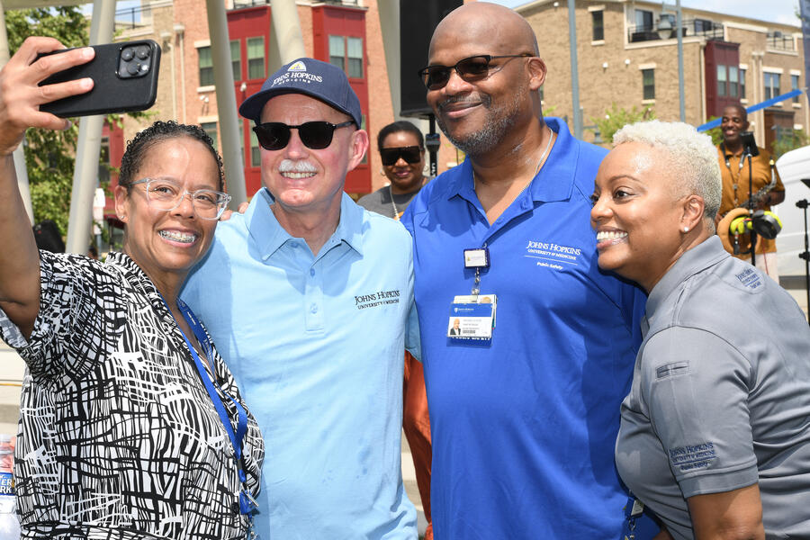 Ted DeWeese, Branville Bard and others during the community walk on July 31