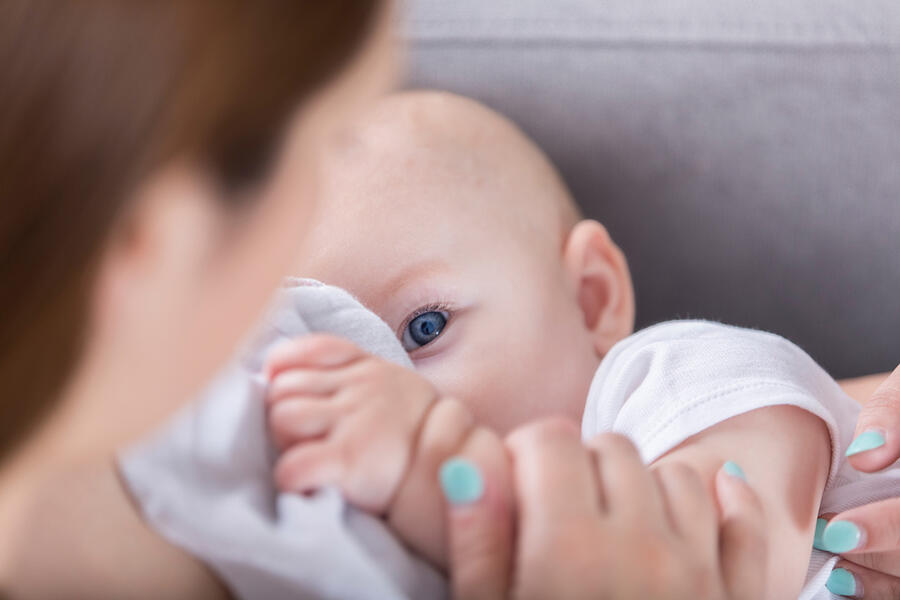 Mother breastfeeding her infant