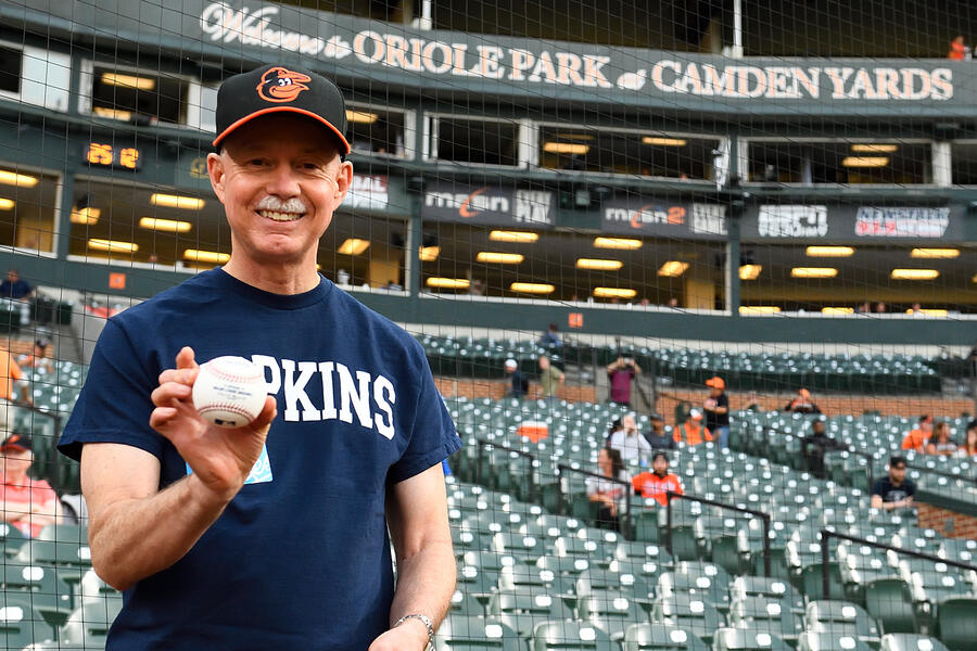 Dean DeWeese holding a baseball