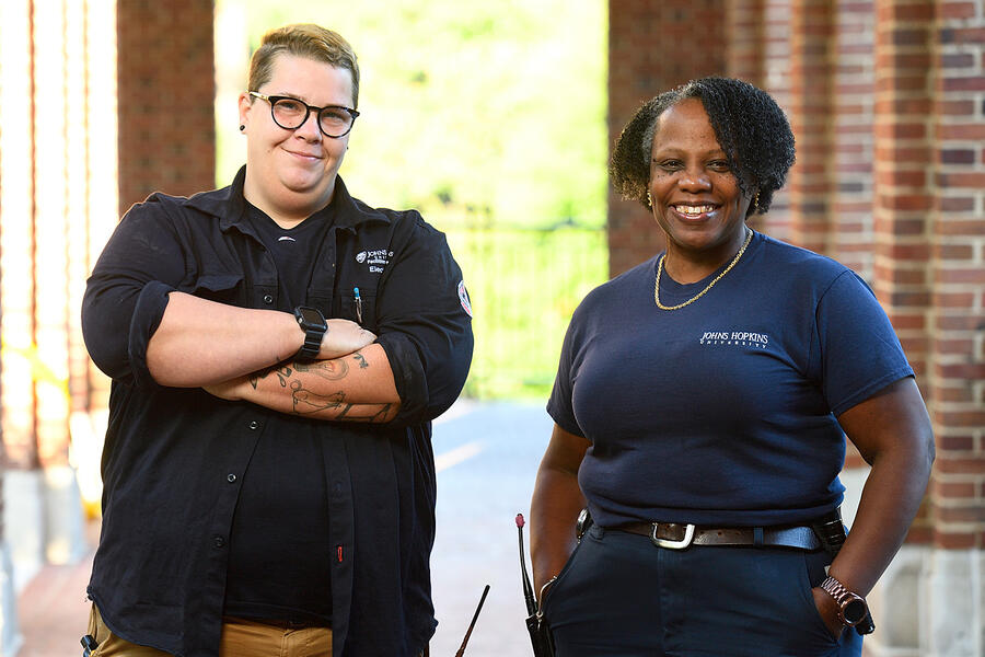 Electrician Tiiu Maiste and plumber Valerie Johnson on the Homewood campus, where they work on all nonhousing buildings.