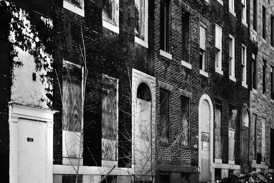 Abandoned Baltimore rowhouses in a black and white photo