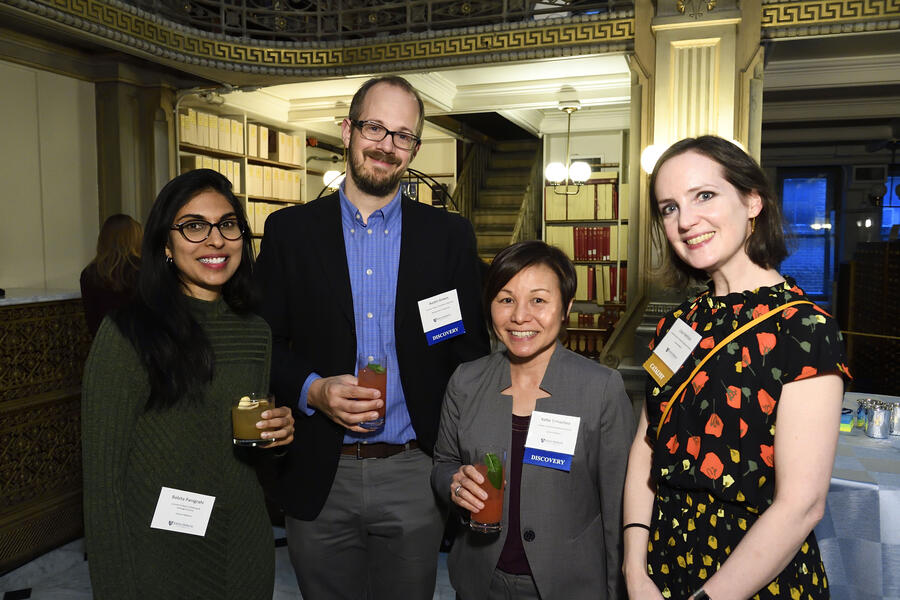 Four people pose for a photo