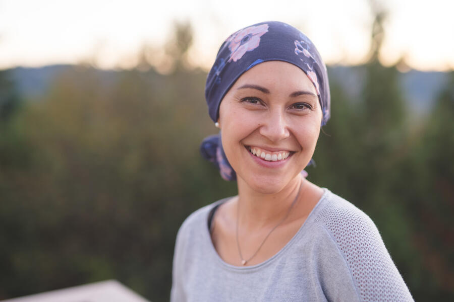 Smiling woman with a scarf-wrapped head