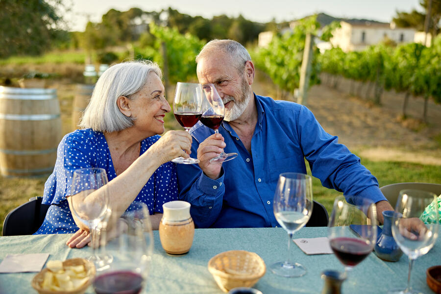 A couple enjoys a glass of wine in a California Vineyard