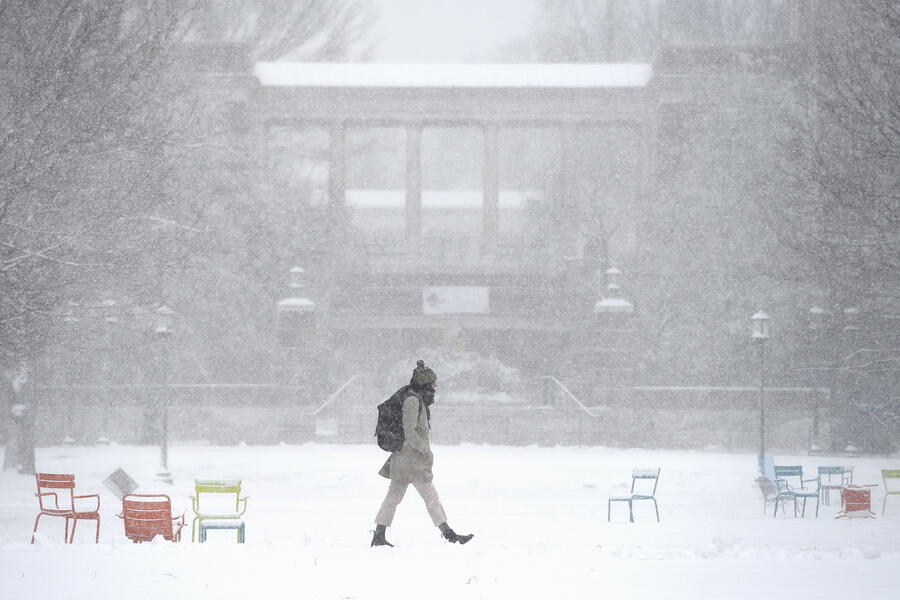 A student walks in the snow