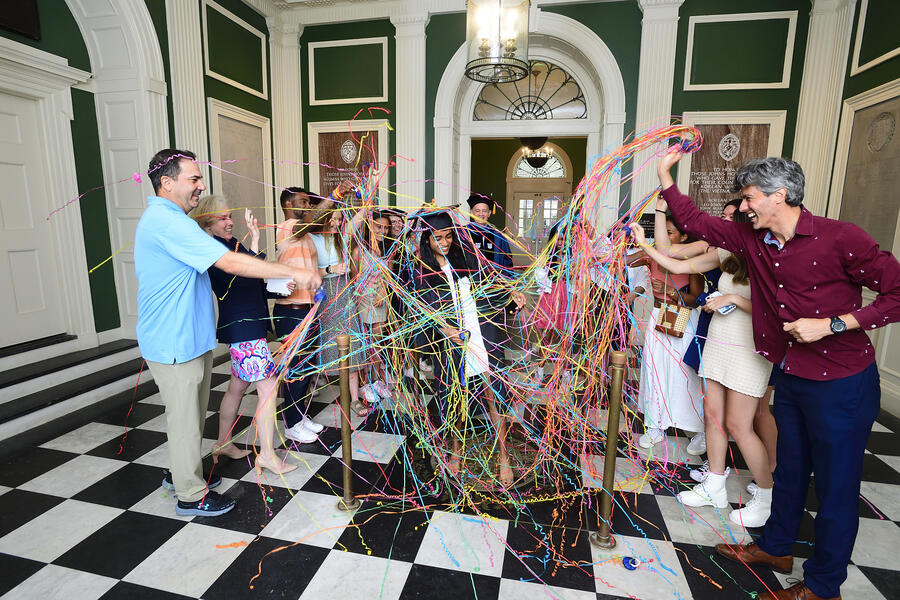 Harrinee Senthilkumar covered in streamers thrown by friends and family