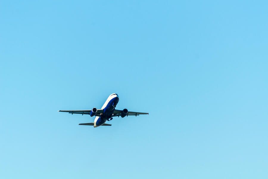 Passenger plane flying in the blue sky