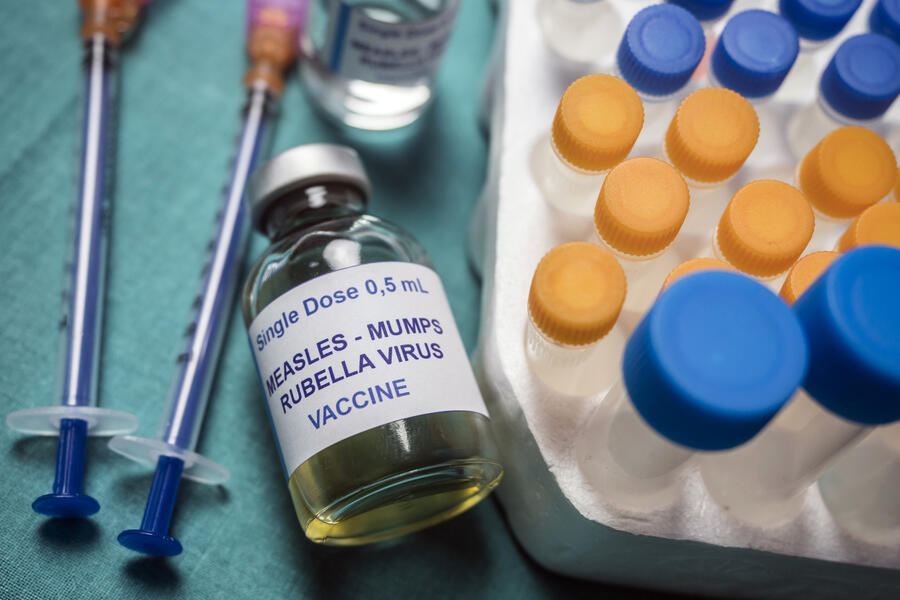 Different vials of triple viral vaccine of measles, rubella and mumps, known as MMR, conceptual image