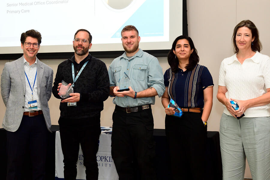 Vice Provost Kevin Shollenberger and award recipients Tristan Barsky, Zach Pocchia, Shaherbano Khalid, and Gillian Furlong.