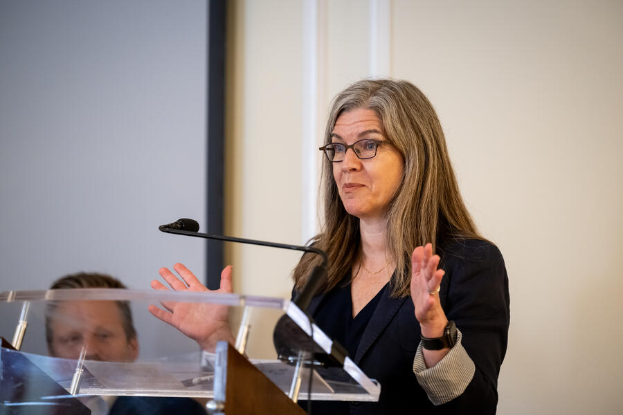 Jaishri Blakeley speaking at a podium 