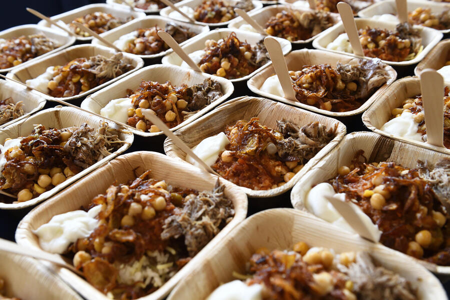 A table full of single-serving koshary bowls