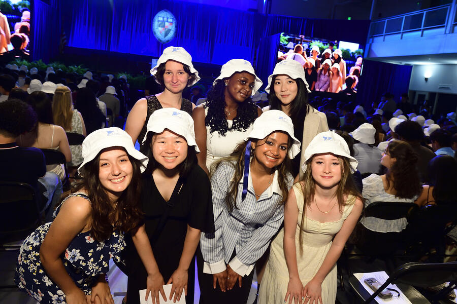 Students wearing bucket hats at convocation
