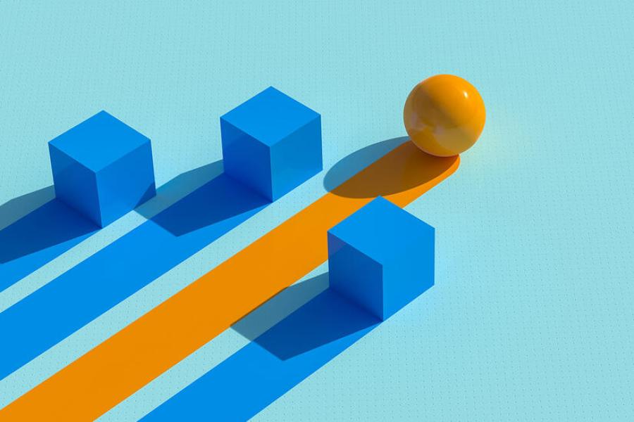 Yellow ball leading three blue squares behind it