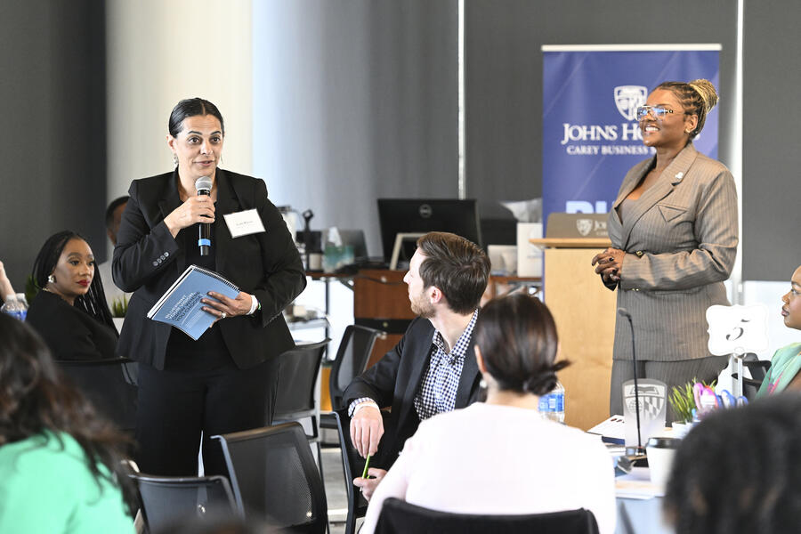 Two speakers stand to lead the discussion at the Pivot with Purpose workshop