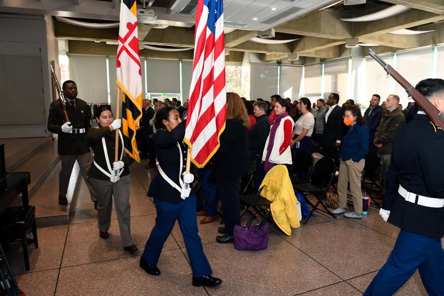 A color guard presents U.S. and Maryland flags
