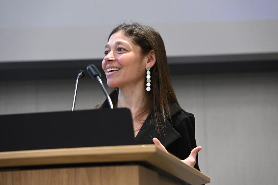 Jamie Spangler speaks at a podium.