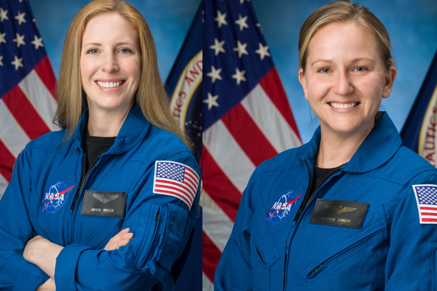From left to right: Imelda Muller, Rebecca Lawler. The two women are wearing blue NASA jackets and standing in front of American flags.