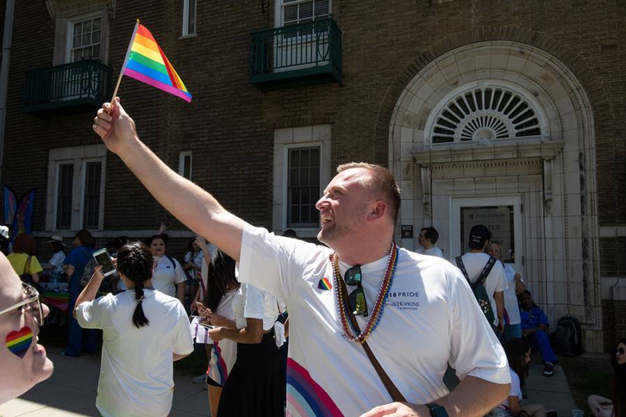 Man waves gay pride flag