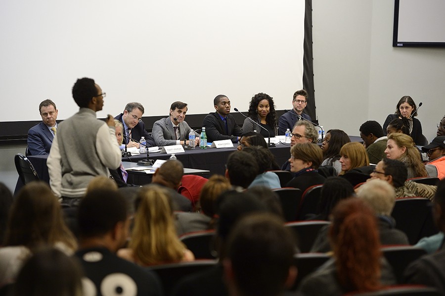 An alumnus addresses the panel of administrators and representatives of the Black Student Union