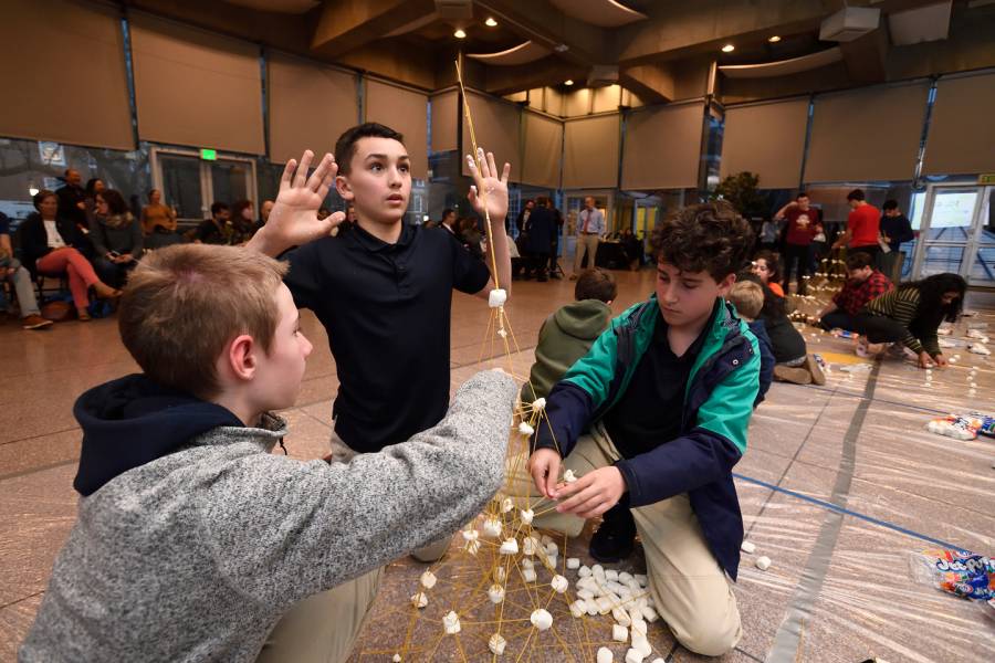 Participants build structures from marshmallows and pasta at Tower of Power