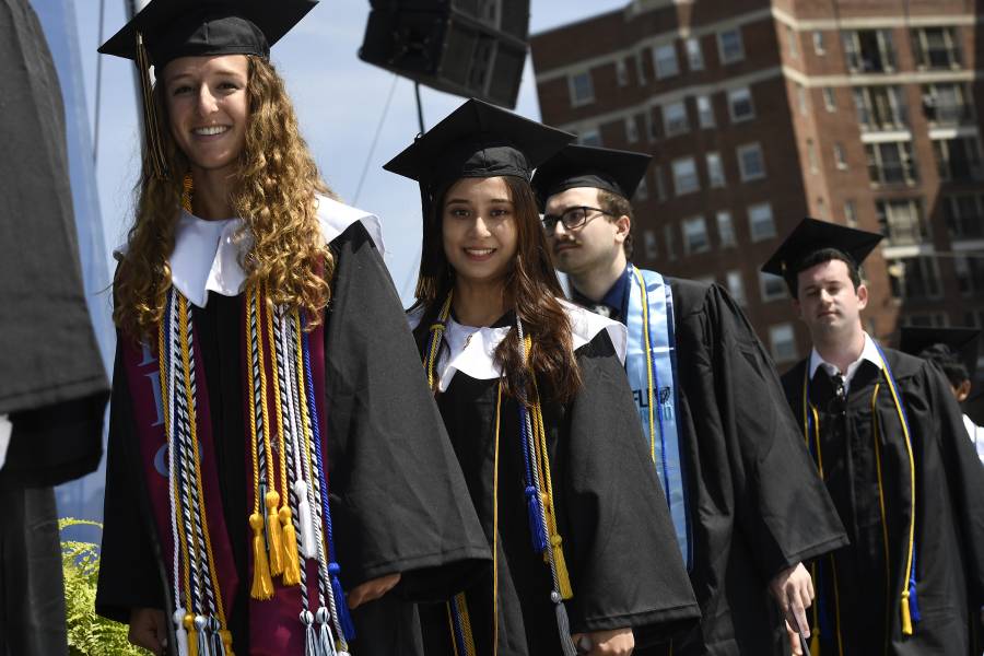 Students prepare to cross the stage at Commencement