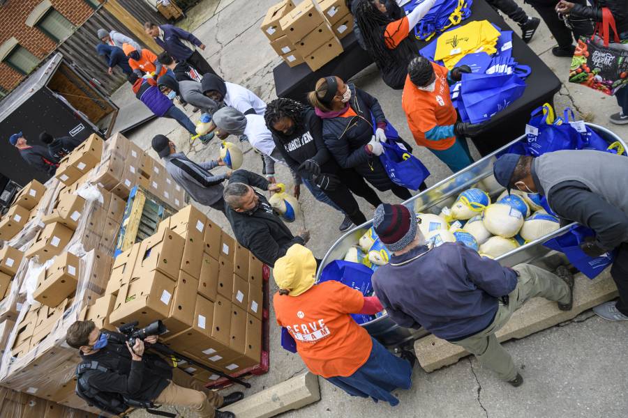 Groups of people organize donated food