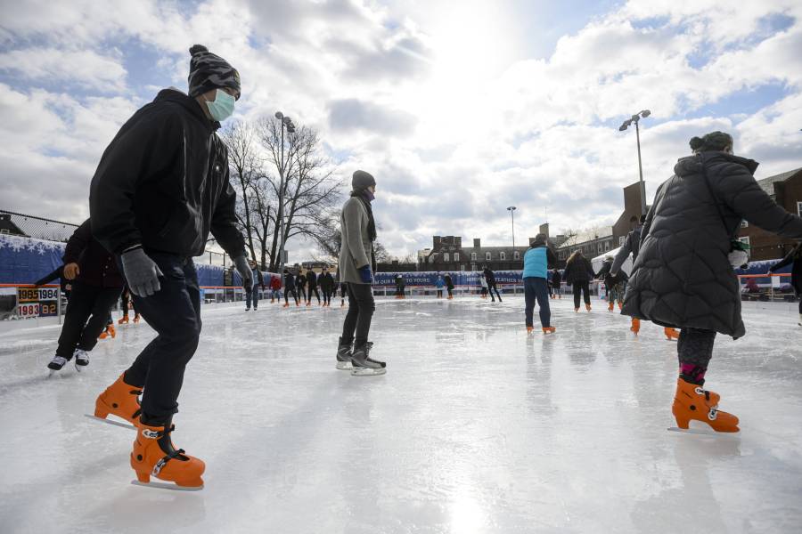 People skate in the sunshine