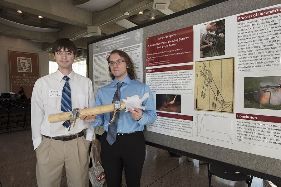 Streit Cunningham (left) and Alex De La Vega present their rocket prototype